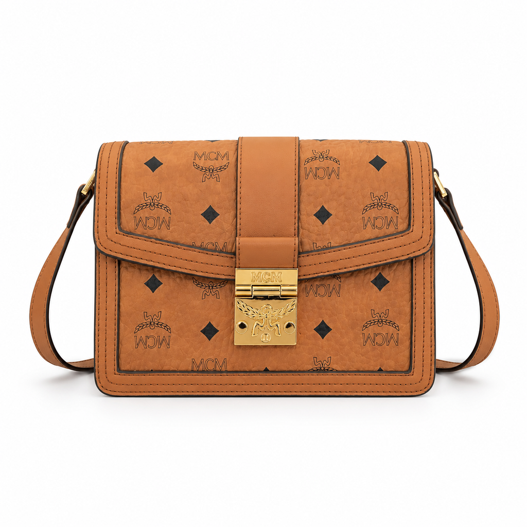 Made in MCM cognac-colored Visetos canvas featuring a gold logo clasp adjustable shoulder strap and a lightweight messenger bag style suitable for both men and women