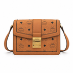 Made in MCM cognac-colored Visetos canvas featuring a gold logo clasp adjustable shoulder strap and a lightweight messenger bag style suitable for both men and women