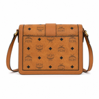Made in MCM cognac-colored Visetos canvas featuring a gold logo clasp adjustable shoulder strap and a lightweight messenger bag style suitable for both men and women
