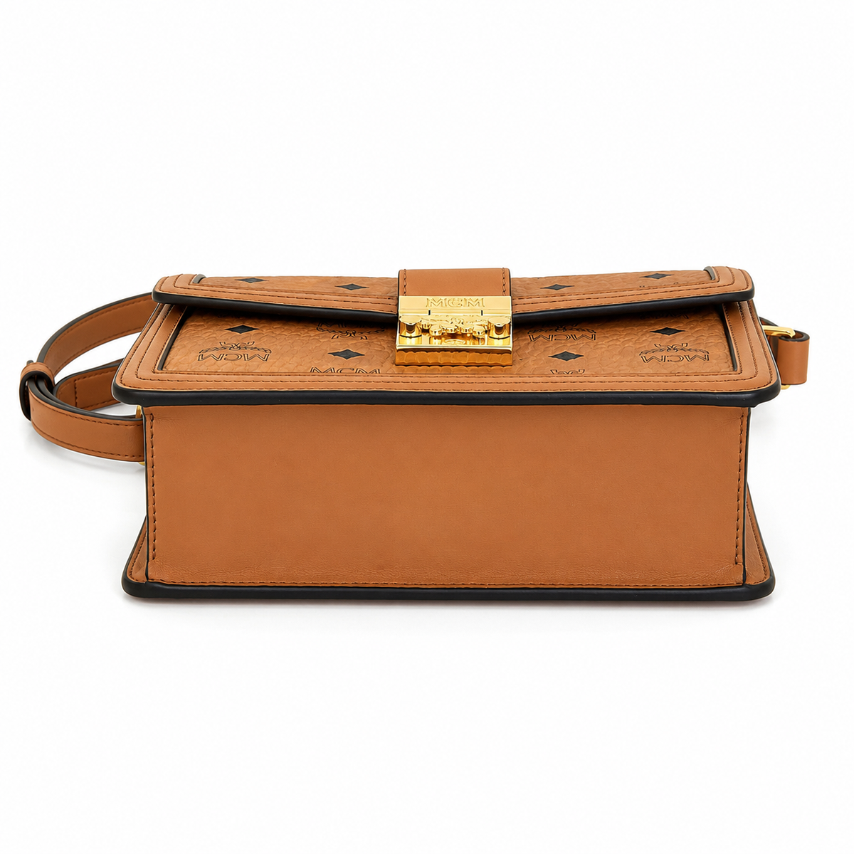 Made in MCM cognac-colored Visetos canvas featuring a gold logo clasp adjustable shoulder strap and a lightweight messenger bag style suitable for both men and women