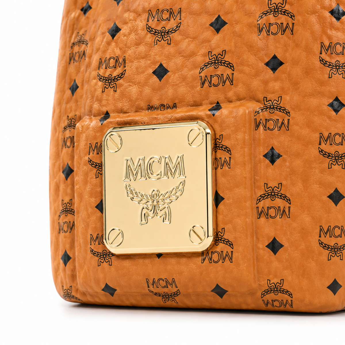 MCM Ensemble Classic Backpack Style Perfume | Cognac-colored Visetos print with gold metal cap perfect for gifting or collecting