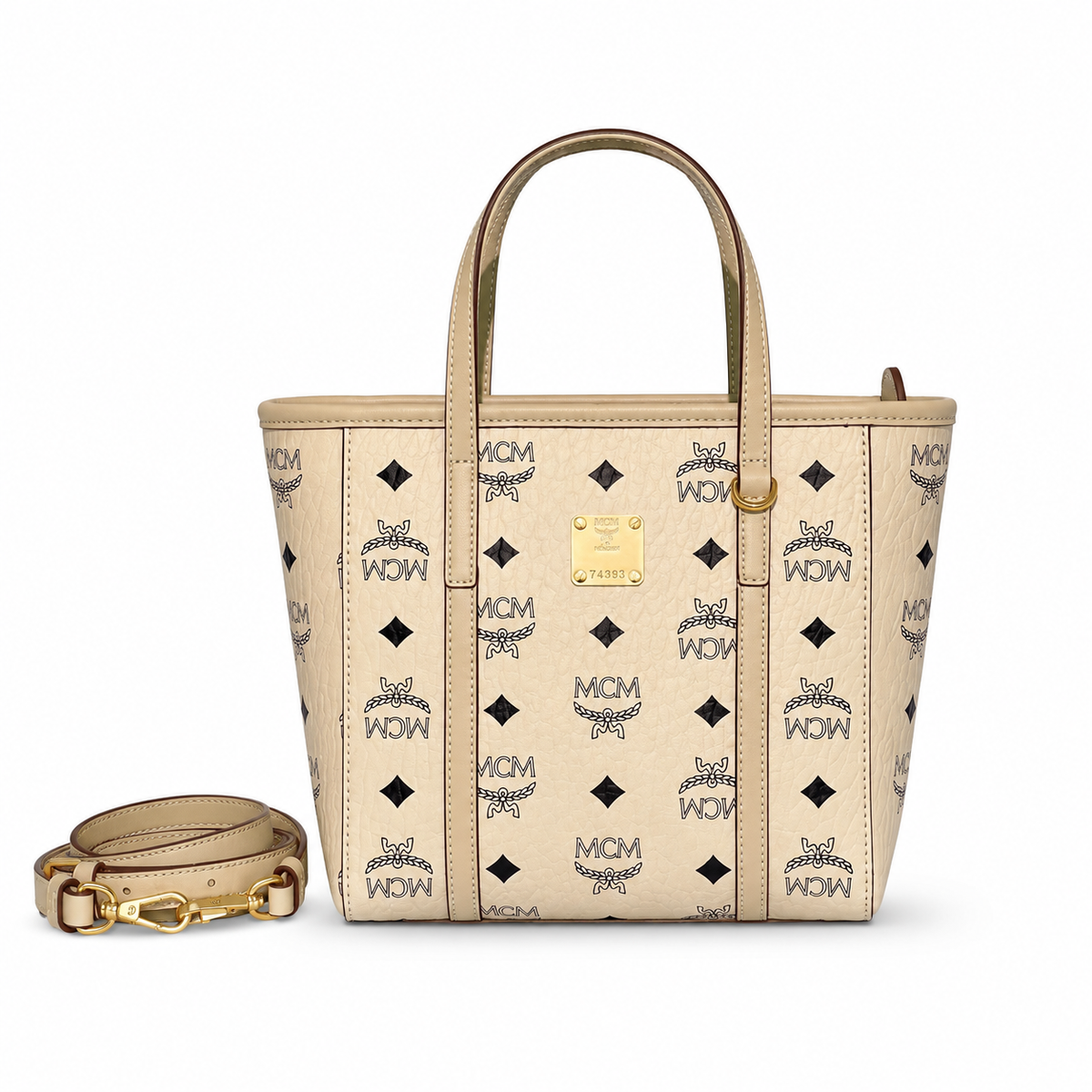 MCM off-white monogram canvas with gold nameplate, detachable shoulder strap, multi-way carrying commuter shopping bag.
