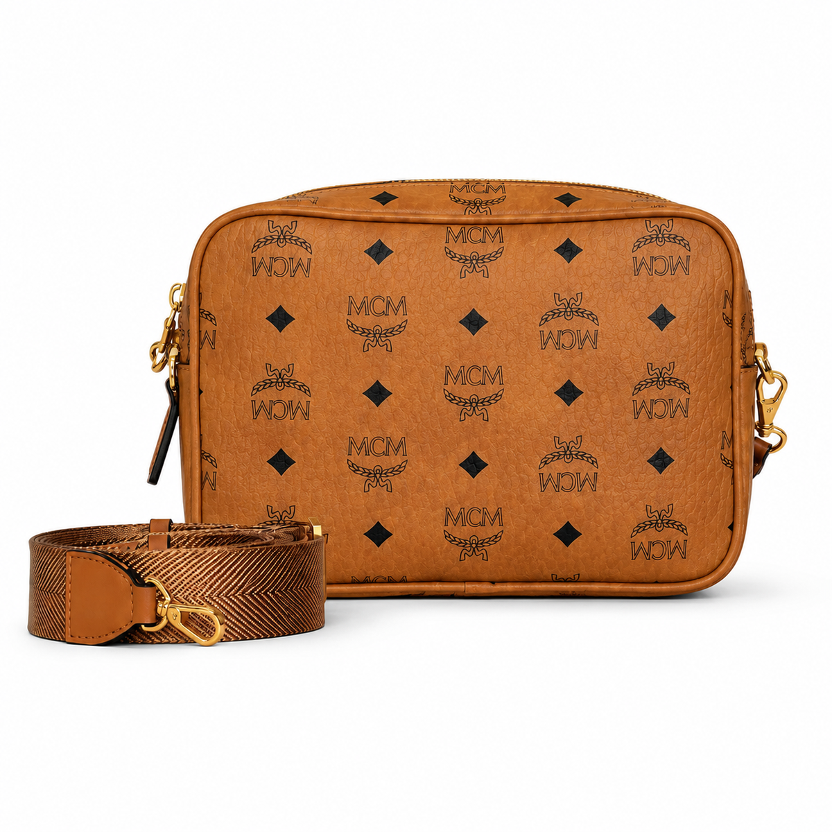 MCM all-over monogram canvas camera bag with adjustable shoulder strap in cognac color Versatile design unisex