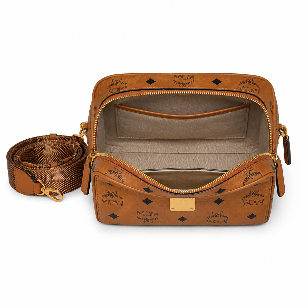 MCM all-over monogram canvas camera bag with adjustable shoulder strap in cognac color Versatile design unisex