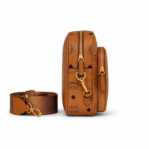 MCM all-over monogram canvas camera bag with adjustable shoulder strap in cognac color Versatile design unisex