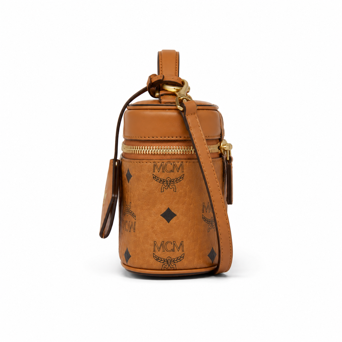 MCM Cognac-colored all-over monogram canvas bag with adjustable shoulder strap can be carried by hand over the shoulder or crossbody