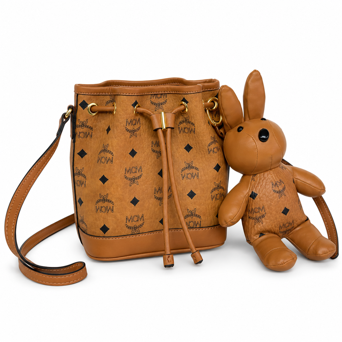 MCM Cognac-colored all-over monogram canvas bag with detachable bunny plush toy drawstring closure mini bucket bag for women