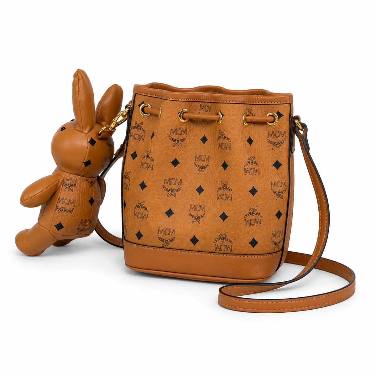 MCM Cognac-colored all-over monogram canvas bag with detachable bunny plush toy drawstring closure mini bucket bag for women