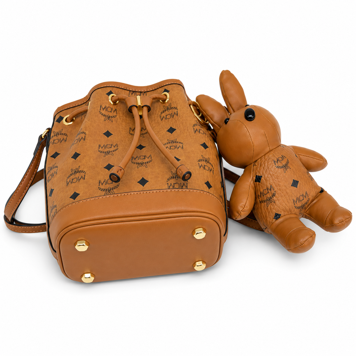 MCM Cognac-colored all-over monogram canvas bag with detachable bunny plush toy drawstring closure mini bucket bag for women
