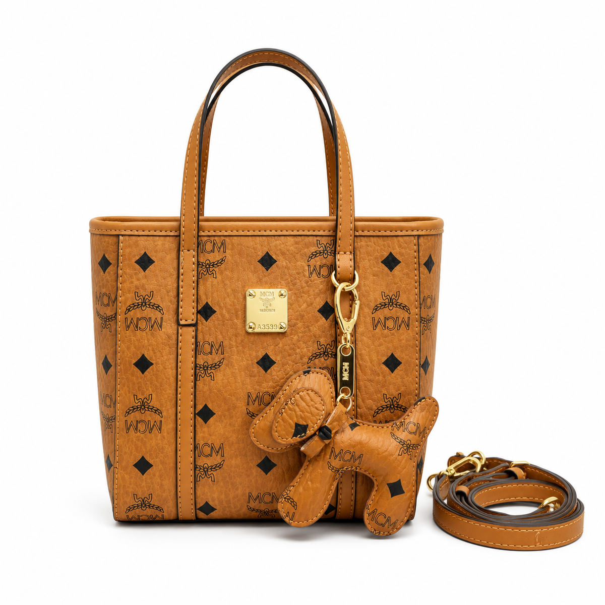 MCM Cognac-colored all-over monogram canvas bag with detachable shoulder strap and puppy charm versatile for hand-carry shoulder-carry or crossbody wear