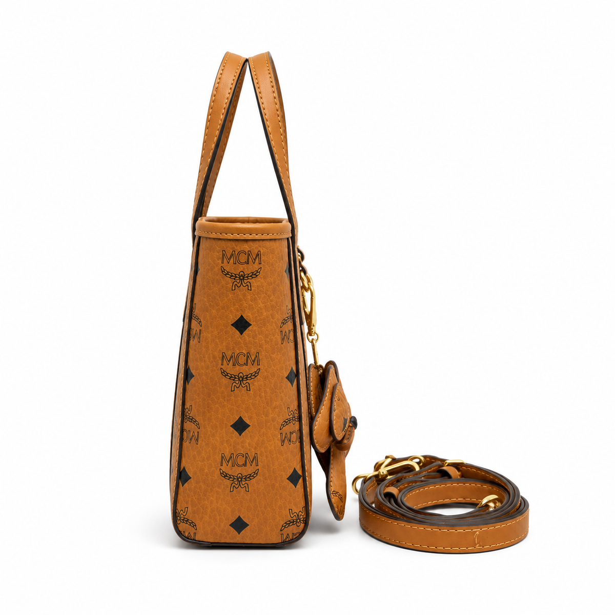 MCM Cognac-colored all-over monogram canvas bag with detachable shoulder strap and puppy charm versatile for hand-carry shoulder-carry or crossbody wear