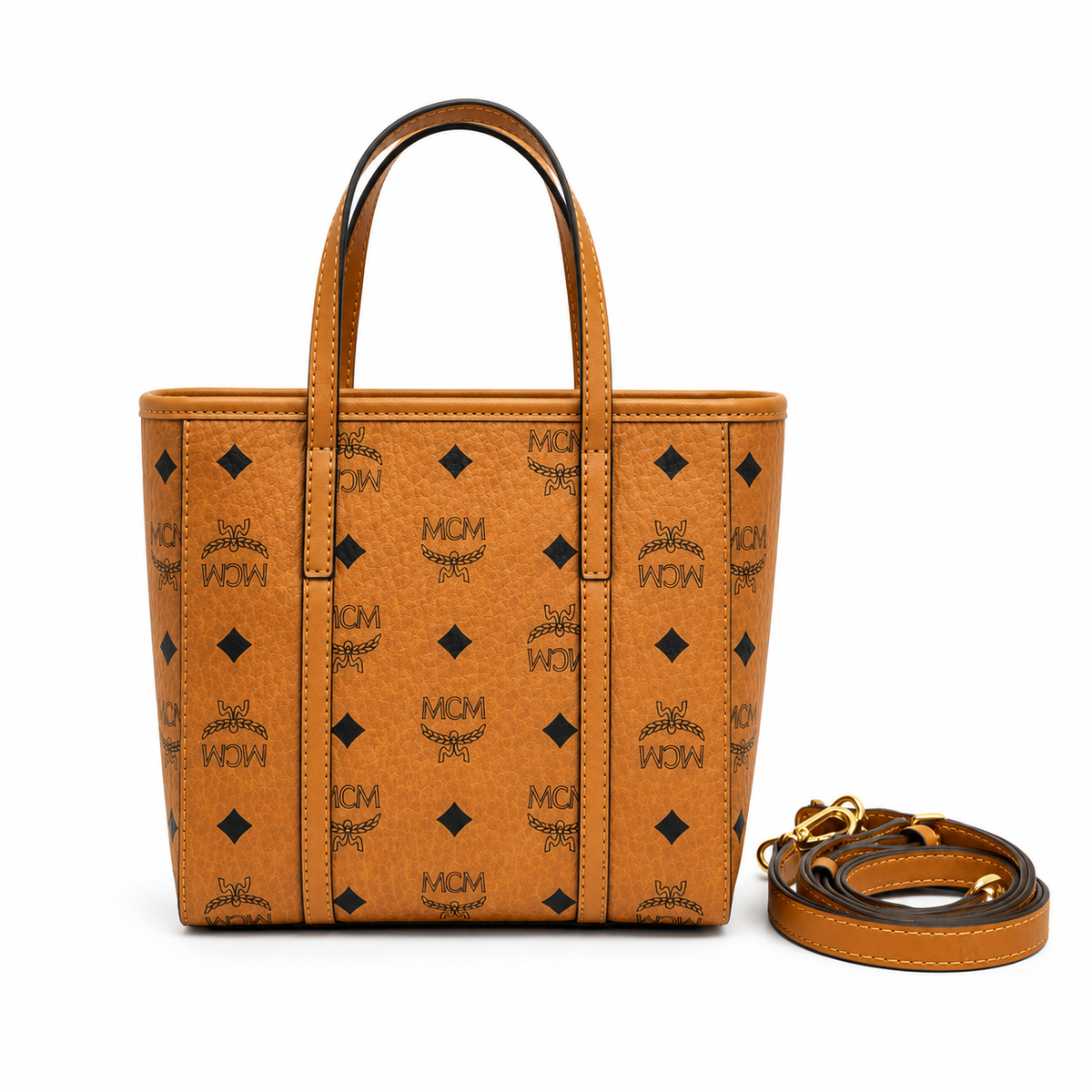 MCM Cognac-colored all-over monogram canvas bag with detachable shoulder strap and puppy charm versatile for hand-carry shoulder-carry or crossbody wear