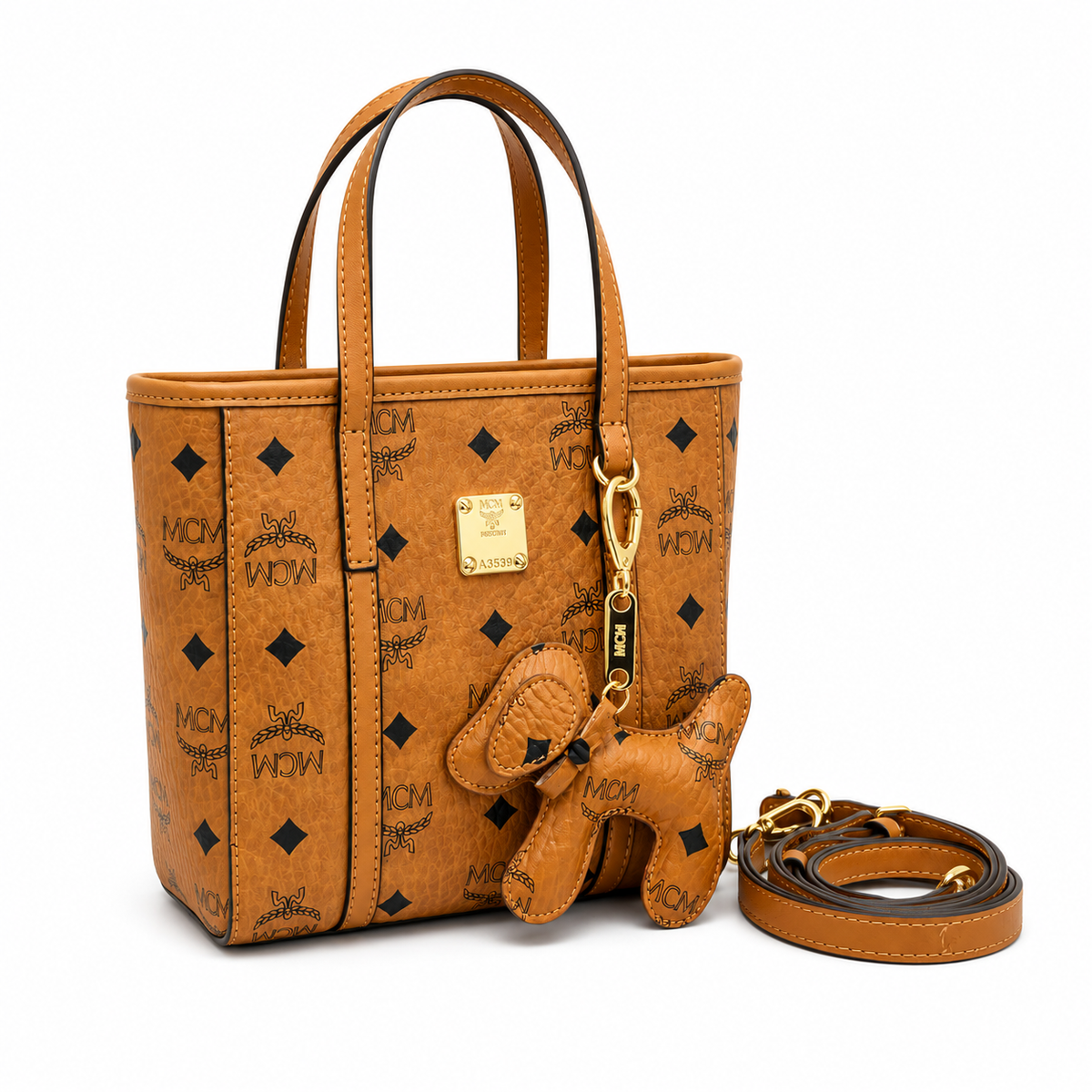 MCM Cognac-colored all-over monogram canvas bag with detachable shoulder strap and puppy charm versatile for hand-carry shoulder-carry or crossbody wear