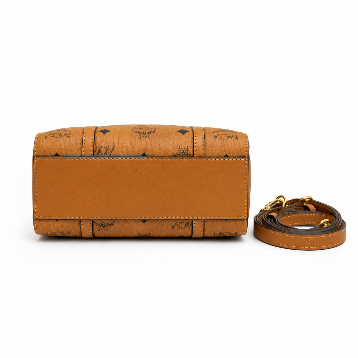 MCM Cognac-colored all-over monogram canvas bag with detachable shoulder strap and puppy charm versatile for hand-carry shoulder-carry or crossbody wear