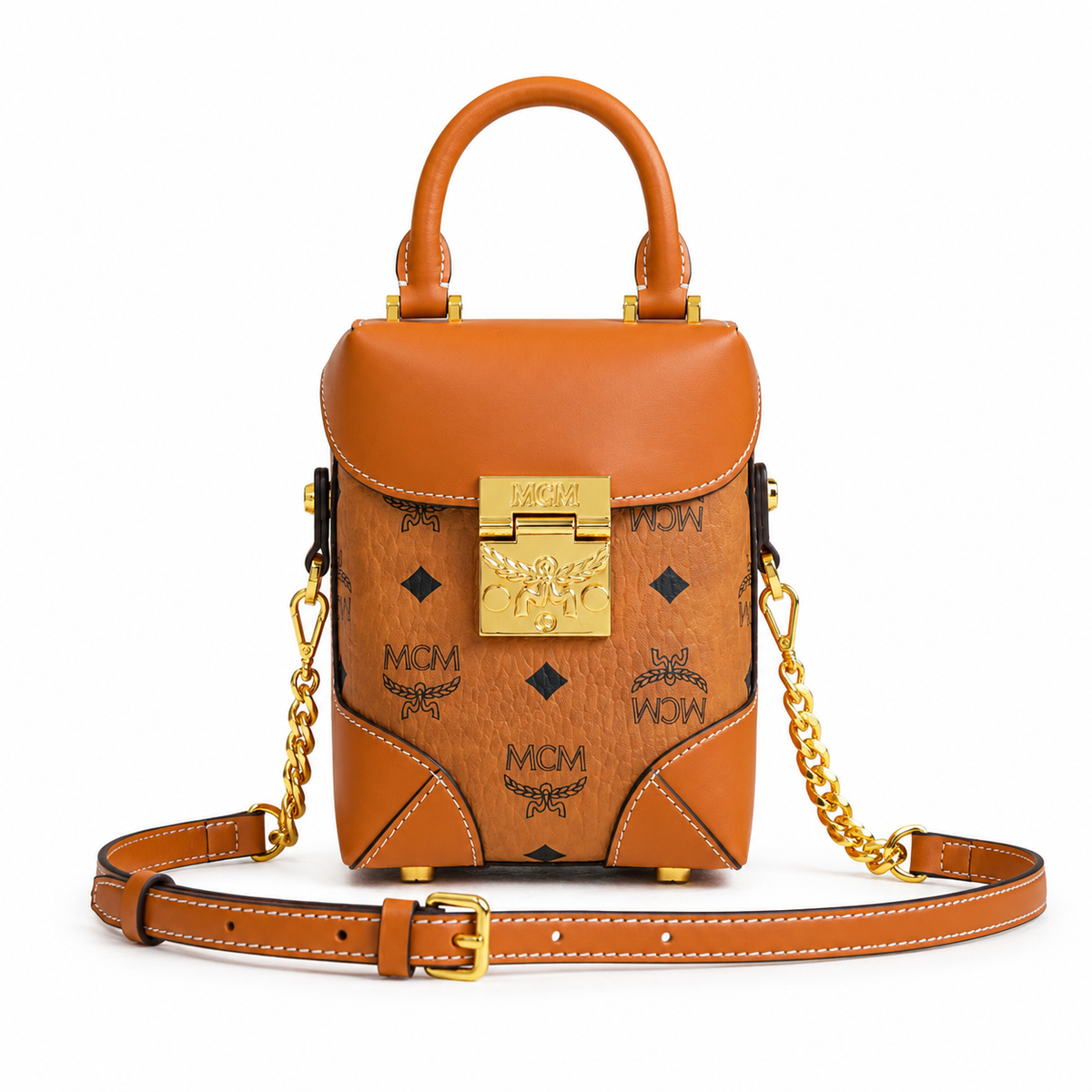 MCM cognac-colored all-over monogram canvas with a gold laurel leaf clasp Adjustable shoulder strap can be carried by hand over the shoulder or crossbody Multi-purpose women's bag