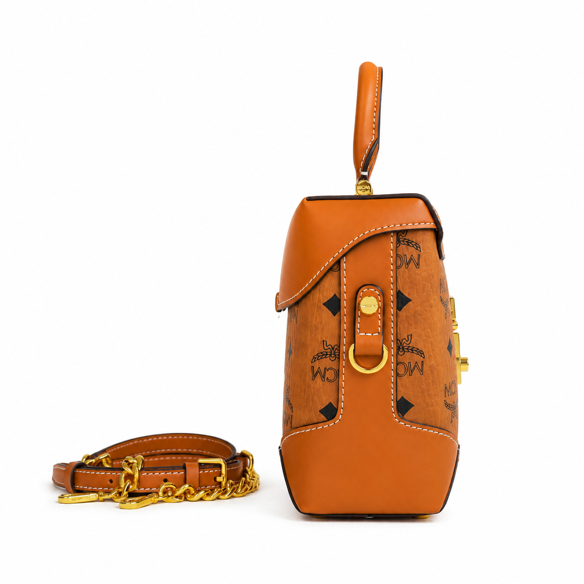 MCM cognac-colored all-over monogram canvas with a gold laurel leaf clasp Adjustable shoulder strap can be carried by hand over the shoulder or crossbody Multi-purpose women's bag