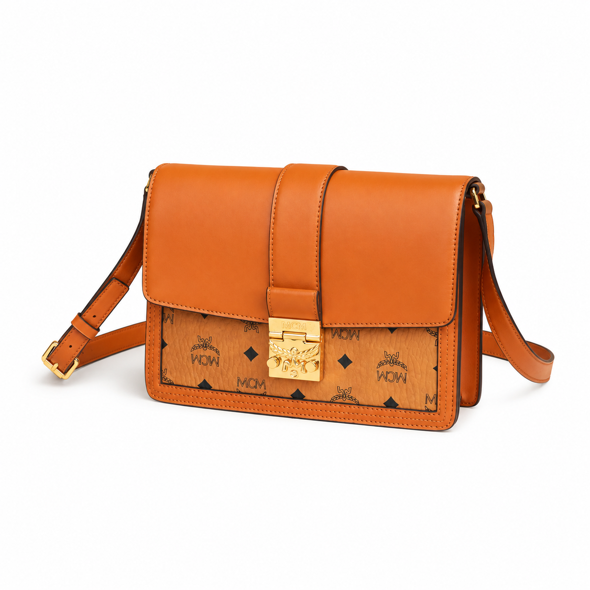 MCM monogram canvas with gold laurel leaf clasp, adjustable shoulder strap, versatile for single-shoulder or crossbody wear.