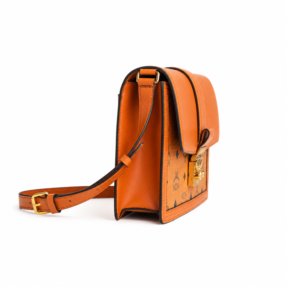 MCM monogram canvas with gold laurel leaf clasp, adjustable shoulder strap, versatile for single-shoulder or crossbody wear.