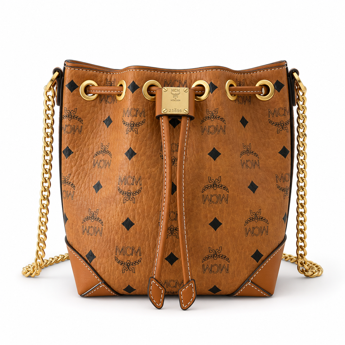 MCM Cognac-colored all-over monogram canvas bag with adjustable shoulder strap can be carried by hand over the shoulder or crossbody