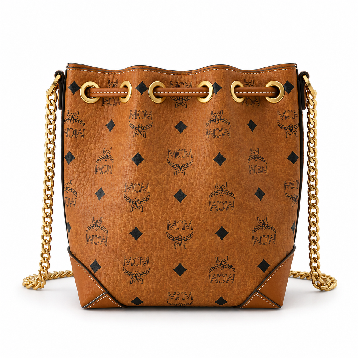 MCM Cognac-colored all-over monogram canvas bag with adjustable shoulder strap can be carried by hand over the shoulder or crossbody