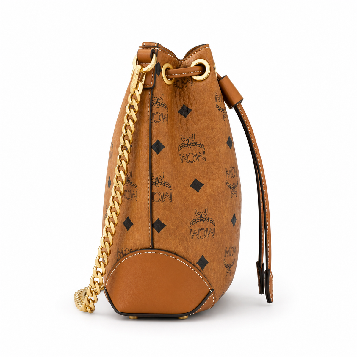 MCM Cognac-colored all-over monogram canvas bag with adjustable shoulder strap can be carried by hand over the shoulder or crossbody