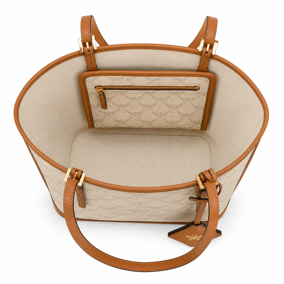 MCM beige laurel leaf with cognac-colored calfskin trim white logo and diamond pendant adjustable handle can be carried by hand over the shoulder or crossbody