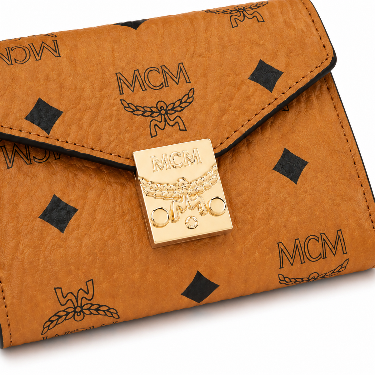 MCM cognac-colored all-over print + gold clasp multi-card slot zippered clutch for women