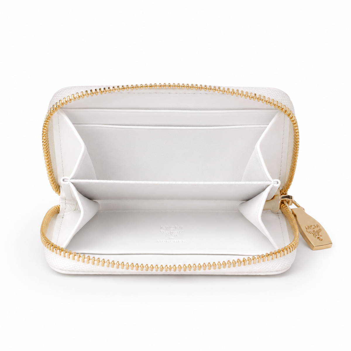 MCM women's clutch bag with white all-over print and gold clasp multiple card slots and zippered compartments