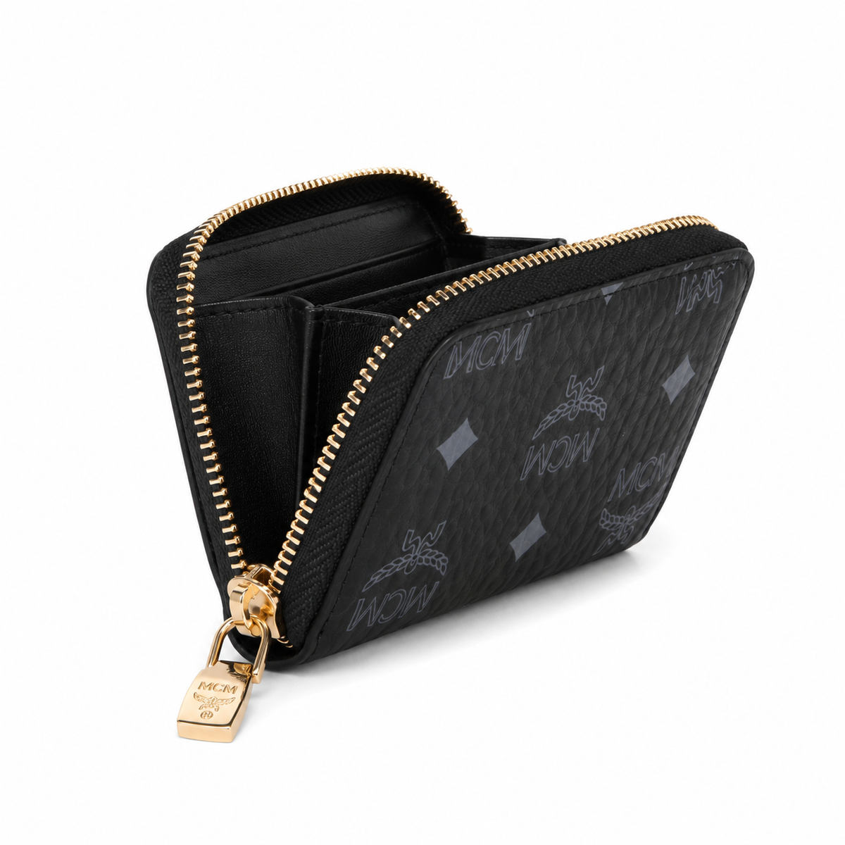MCM women's clutch bag with all-over print in black and gold clasp featuring multiple card slots and zippered compartments