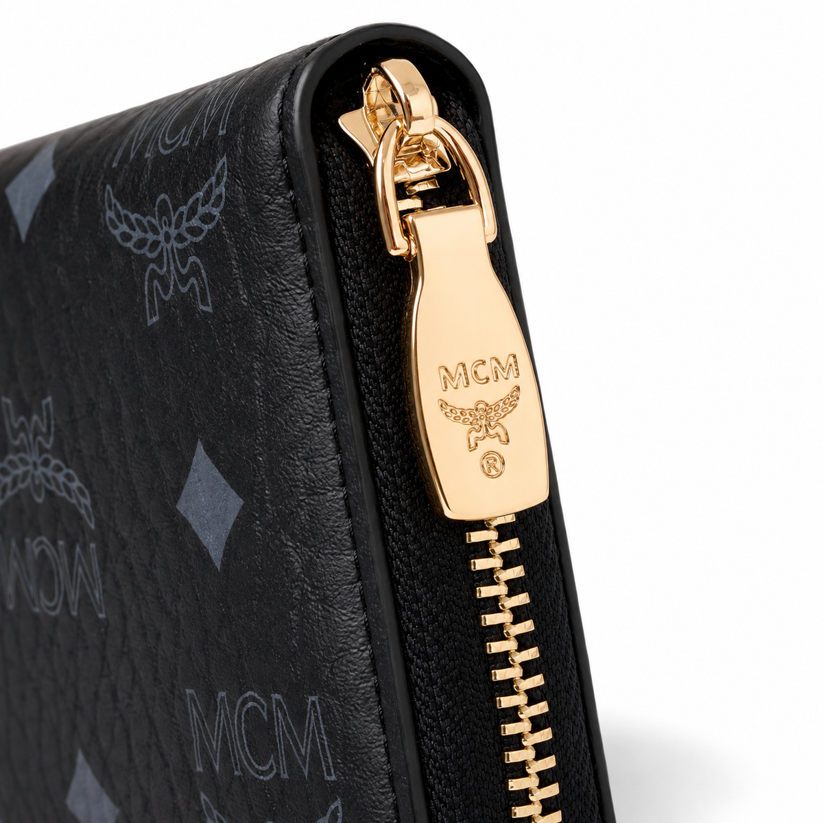 MCM black all-over print with gold clasp multi-card slot zippered clutch for women
