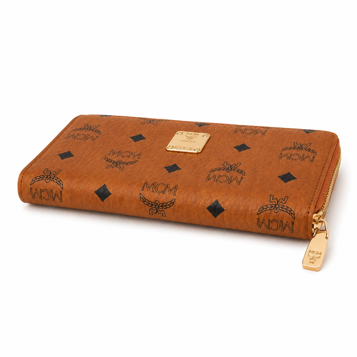 MCM women's clutch bag with all-over print in black and gold clasp featuring multiple card slots and zippered compartments