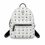 MCM all-over print + side rivets, unisex large-capacity commuter/travel bag.