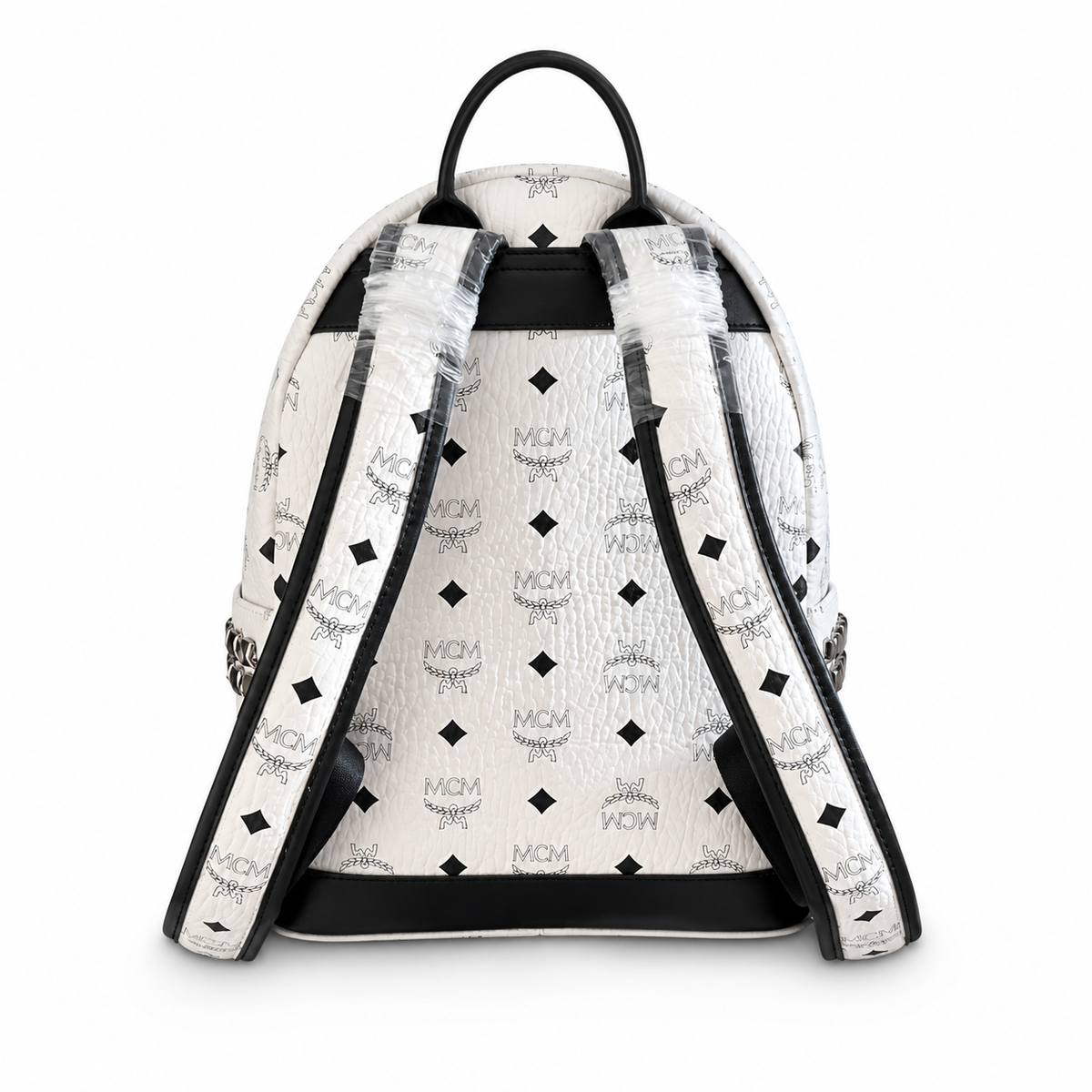 MCM all-over print + side rivets, unisex large-capacity commuter/travel bag.