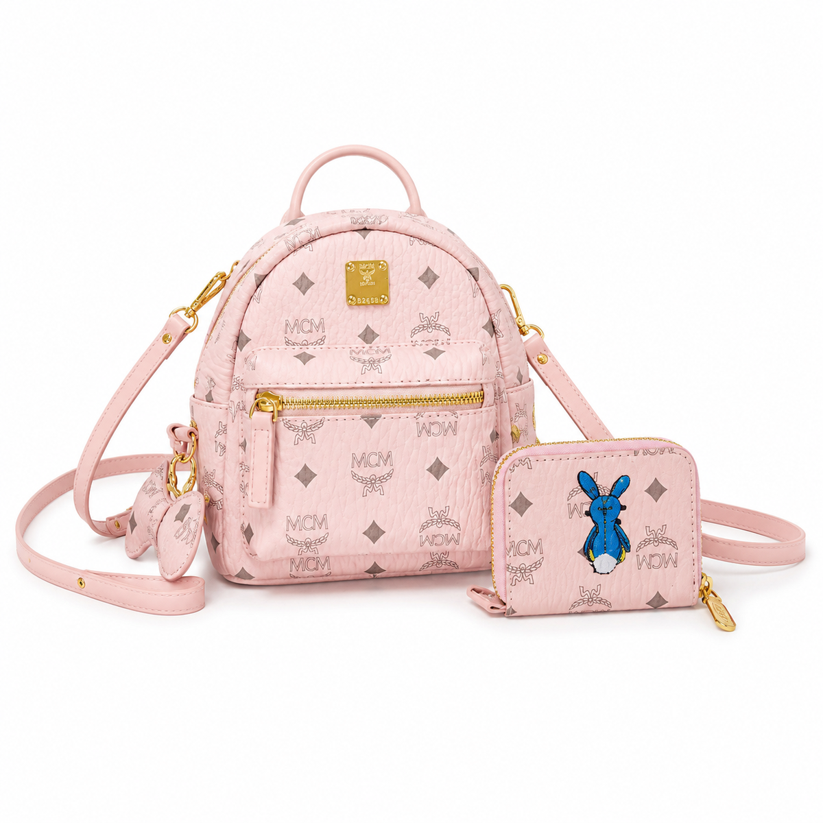 MCM Stark series ultra-mini Visetos print soft pink bag with side studs and a detachable shoulder strap a stylish mini backpack/crossbody bag for women perfect for commuting or outings