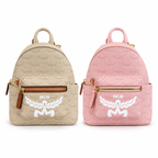 MCM Lauretos Stark Bebe Boo Collection Soft pink with white laurel leaves and gold zippers a stylish mini backpack/crossbody bag for women perfect for commuting or outings