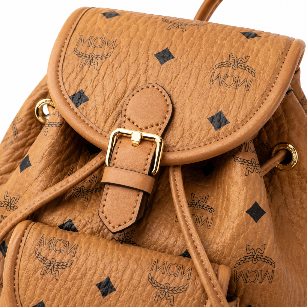 MCM Aren series mini cognac brown monogram canvas bag with flap drawstring and front pocket unisex large-capacity commuter/travel bag