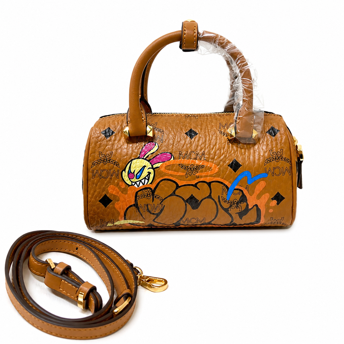 MCM x SAMBYPEN Mini Boston Bag Graffiti Rabbit + Visetos Print + Detachable Shoulder Strap, can be carried by hand or worn crossbody a trendy collectible