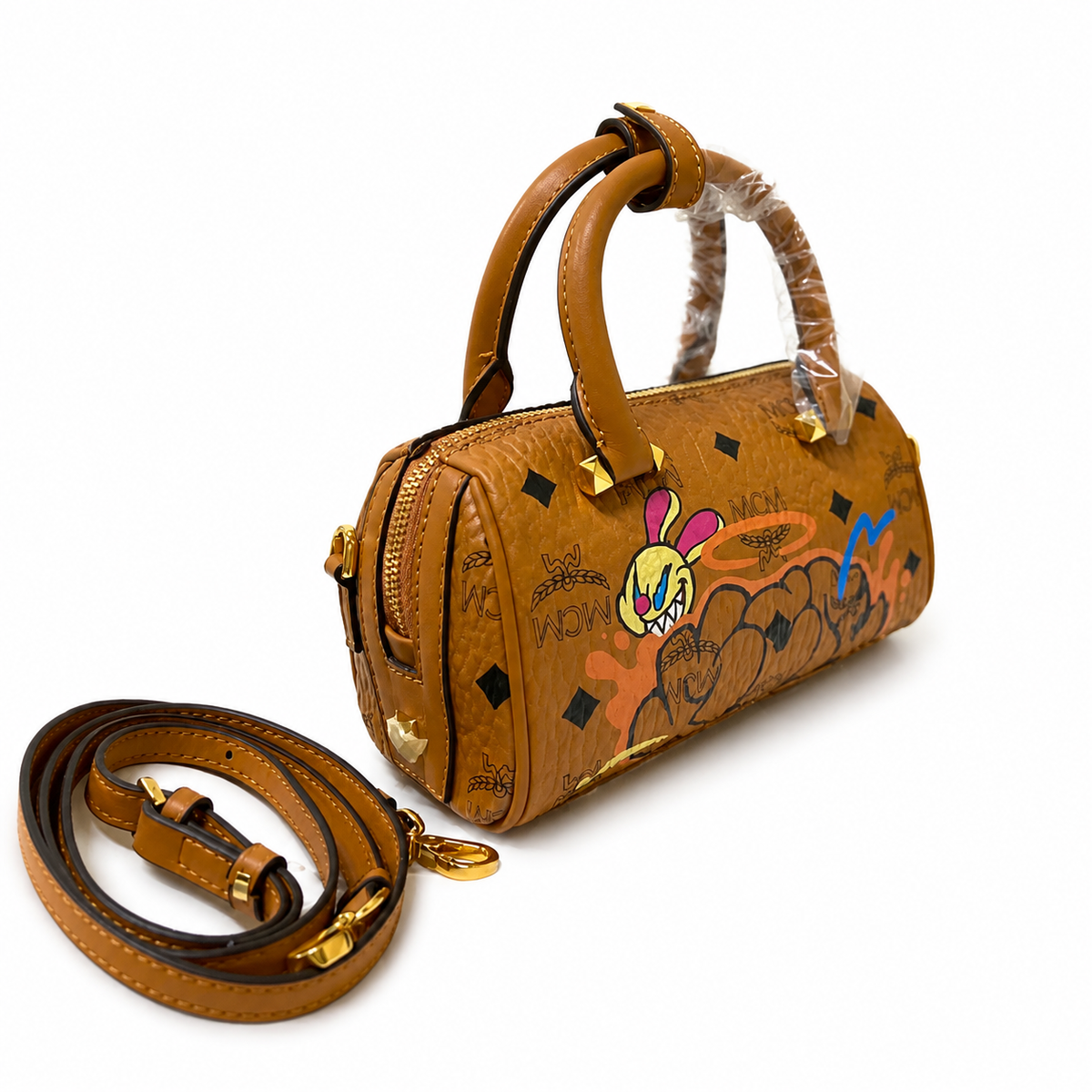 MCM x SAMBYPEN Mini Boston Bag Graffiti Rabbit + Visetos Print + Detachable Shoulder Strap, can be carried by hand or worn crossbody a trendy collectible