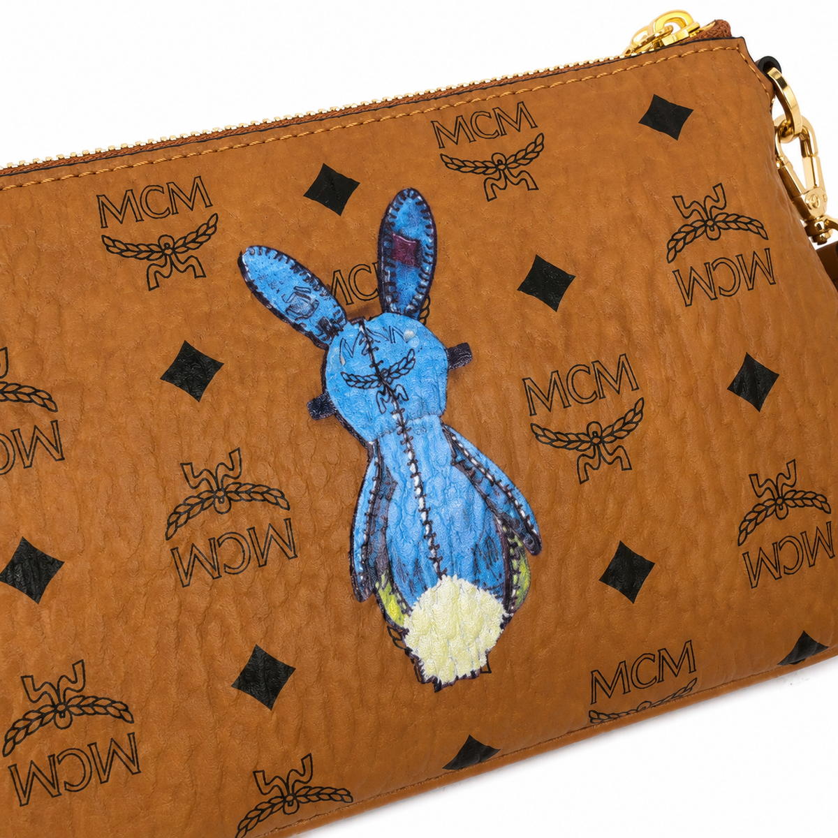 MCM's classic Visetos print rabbit blue embroidered rabbit with gold chain and detachable shoulder strap can be carried by hand or worn crossbody a trendy collectible