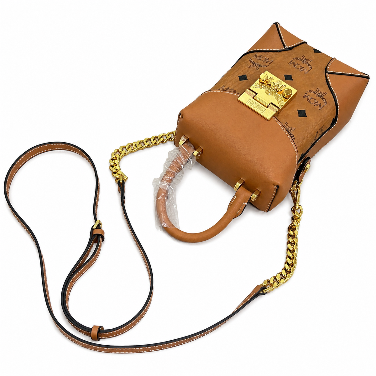 MCM Soft Berlin Mini Fries Bag | Cognac-colored Visetos print + detachable shoulder strap can be carried by hand or worn crossbody Spring/Summer 2026 new arrival